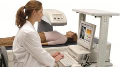 How is bone and spine densitometry performed?